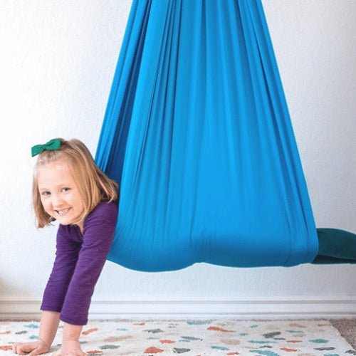 Therapeutic sensory swing for children designed to support focus and provide a calming experience, featuring easy assembly and durable materials. 0